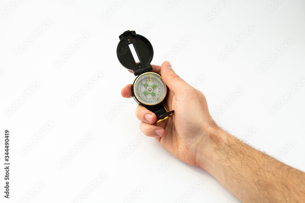 compass in hand on a white background compass in hand on a white background