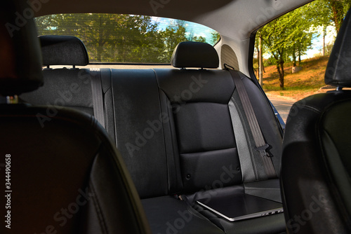 Modern car interior - rear seats with the seat belts © izikmd