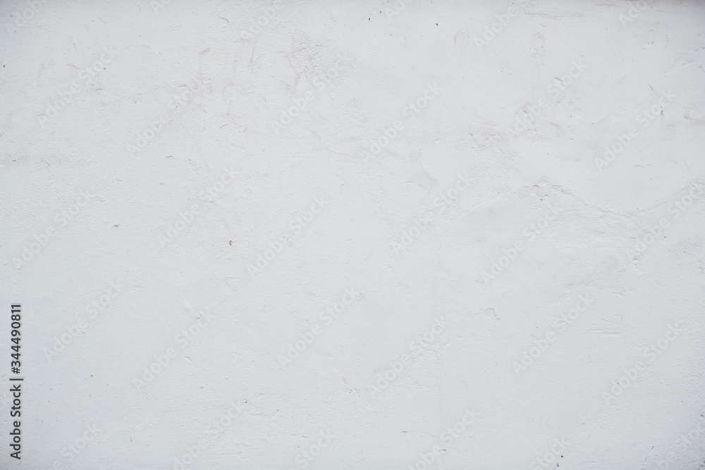 A white concrete wall. Texture and background A white concrete wall. Texture and background