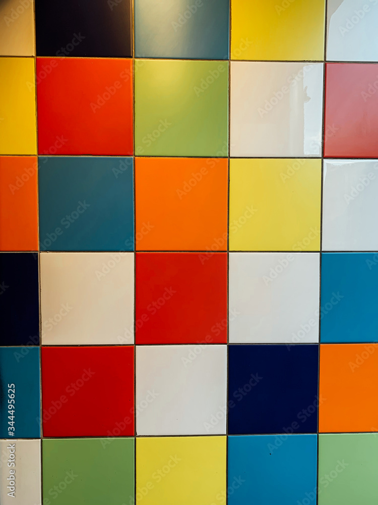 multicolored tile squares on the wall a background