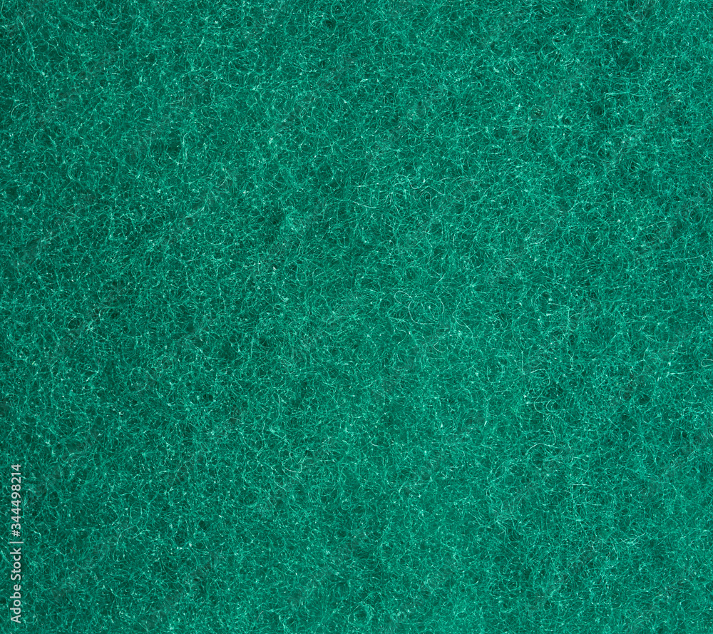 green texture of a kitchen sponge with fibers, full frame green texture of a kitchen sponge with fibers, full frame