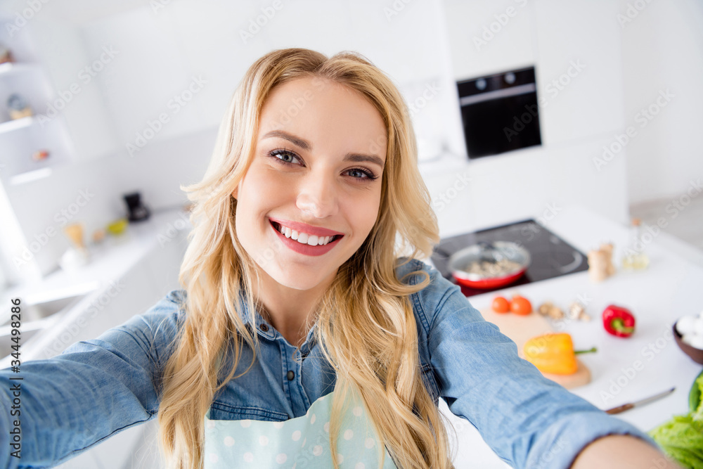 Hello dear followers. Closeup photo of beautiful housewife making selfies recording video vlog cooking blogger tasty vegan meal quarantine stay home time kitchen indoors Hello dear followers. Closeup photo of beautiful housewife making selfies recording video vlog cooking blogger tasty vegan meal quarantine stay home time kitchen indoors