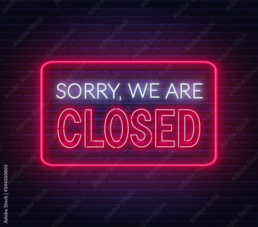 Sorry we are closed neon sign on brick wall background . Sorry we are closed neon sign on brick wall background .