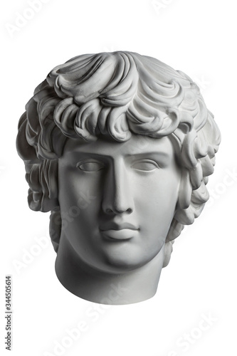 Gypsum copy of famous ancient statue Antinous head isolated on a white background. Plaster antique sculpture young man face. Renaissance epoch. Portrait.