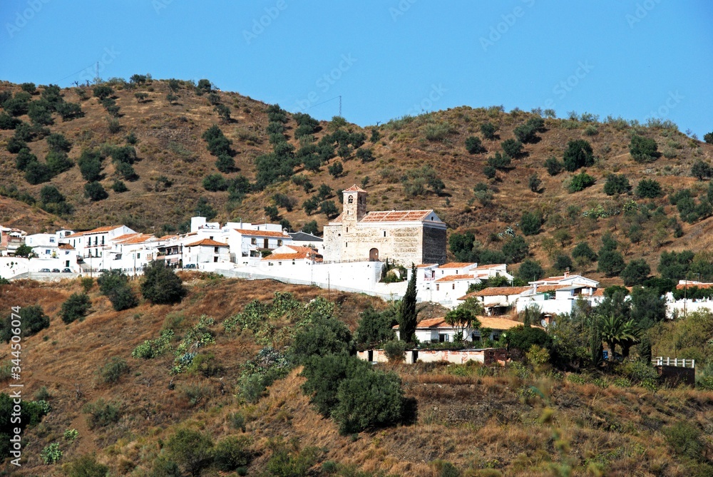 View of a typical whitewashed Andalucian hill town (pueblo blanco), Benaque, Andalusia, Spain.