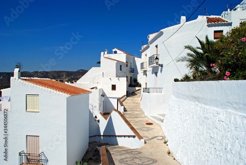 View along a whitewashed village street, Frigiliana, Andalusia, Spain.