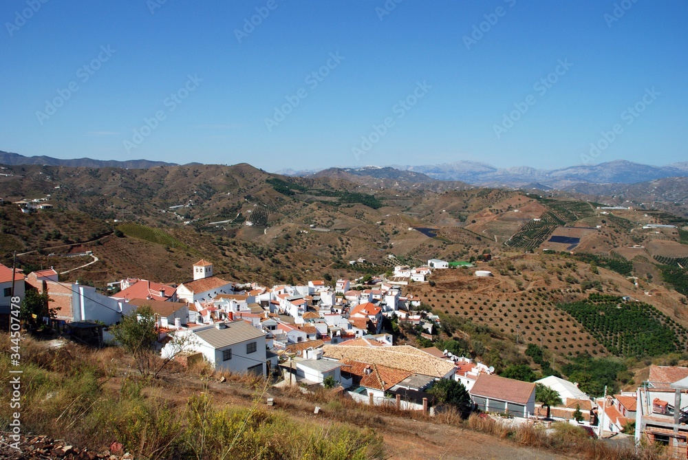 View of white village and surrounding countryside, Iznate, Andalusia, Spain.
