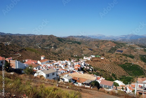 View of white village and surrounding countryside, Iznate, Andalusia, Spain. photo