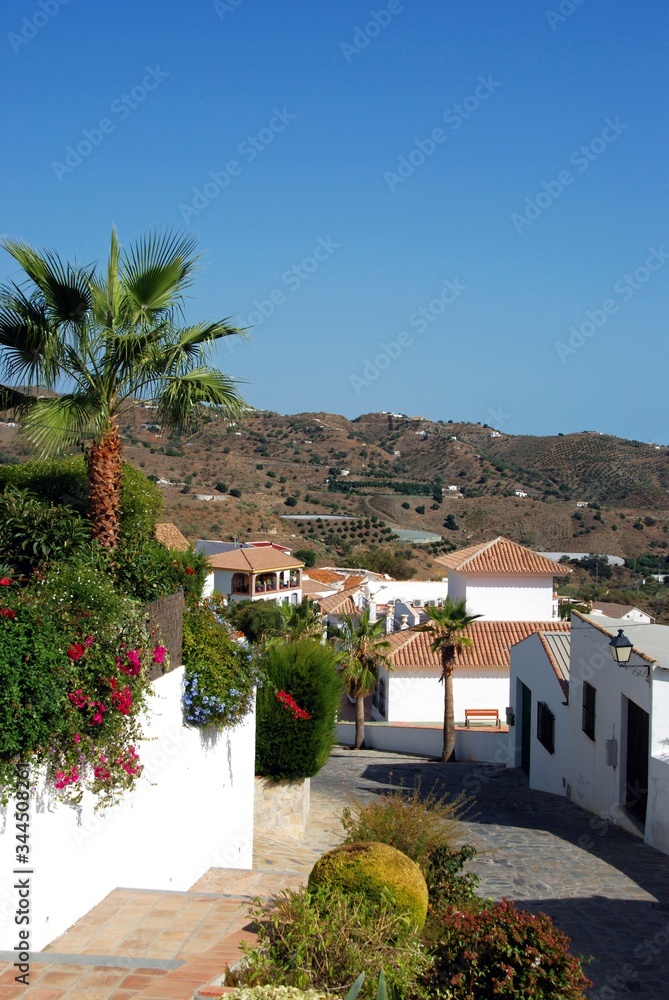 Elevated view along a white village street (pueblo blanco), Macharaviaya, Andalusia, Spain.