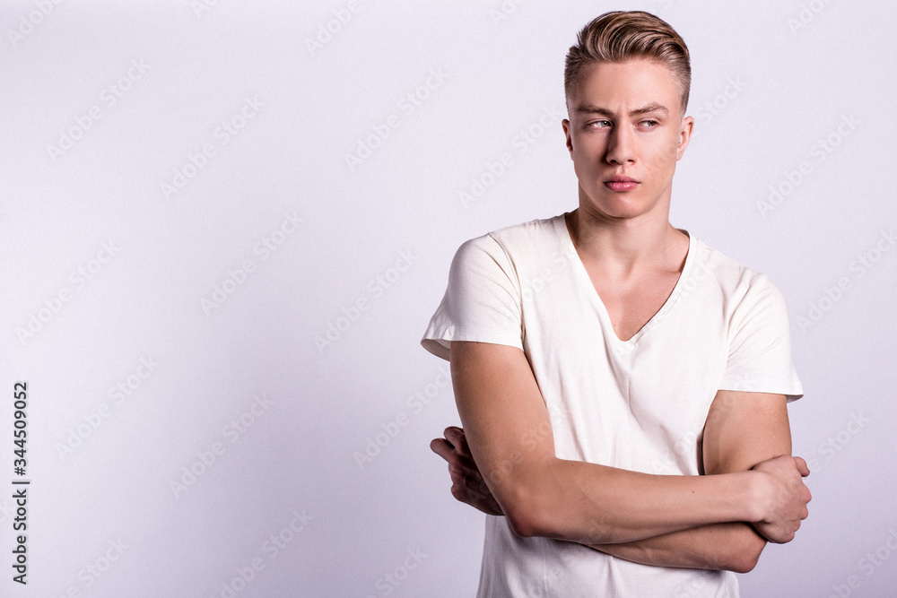 Sexy smiling male model against white background Sexy smiling male model against white background