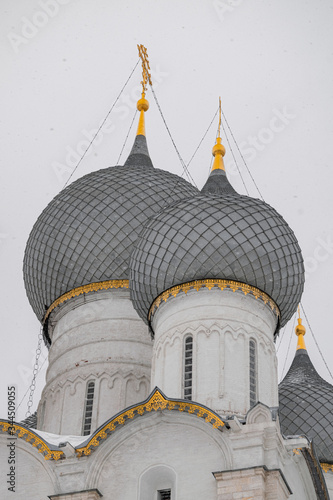 Rostov Kremlin Assumption ortodhox cathedral domes, snowing winter view, Russia golden ring photo