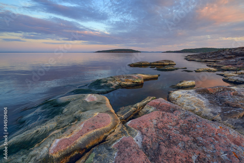 Calm on the lake at dawn, lake Ladoga, Karelia, Russia