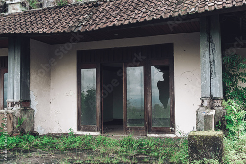 abandoned building with dirty walls and broken roof