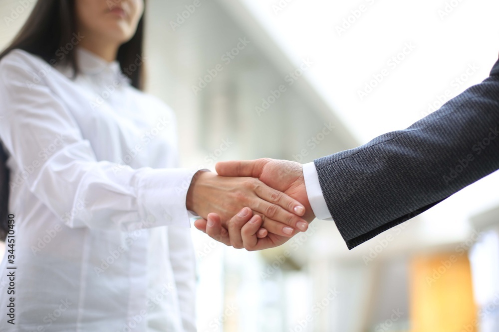 Business partnership handshake concept.Photo two coworkers handshaking process.Successful deal after a great meeting. Business partnership handshake concept.Photo two coworkers handshaking process.Successful deal after a great meeting.