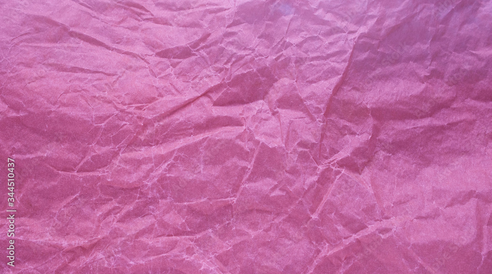 Crumpled paper with a pink texture. Texture of crumpled paper. Crumpled paper. Paper wrinkles