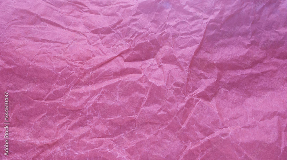 Fototapeta premium Crumpled paper with a pink texture. Texture of crumpled paper. Crumpled paper. Paper wrinkles