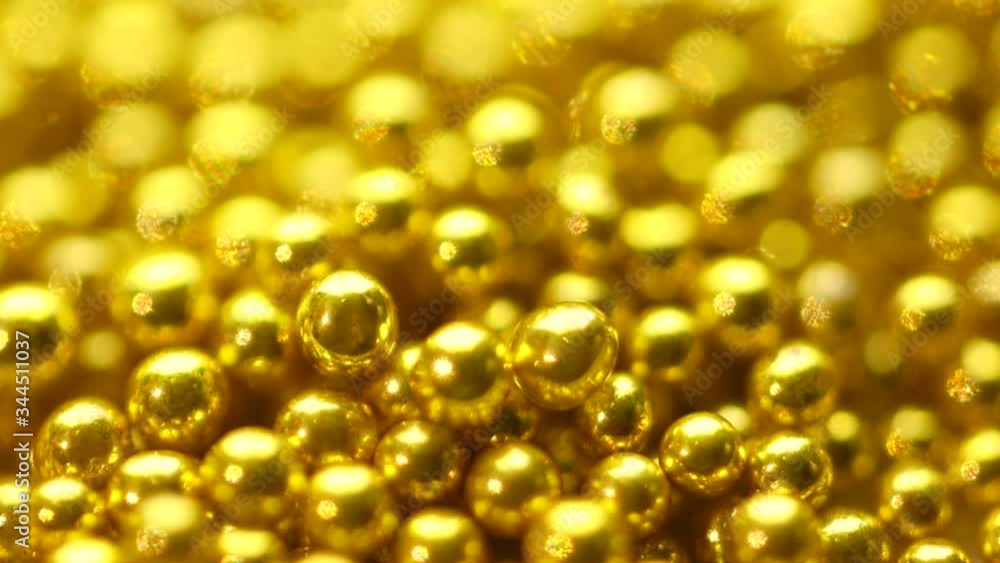 Small balls of gold. Abstract background . Bokeh Small balls of gold. Abstract background . Bokeh