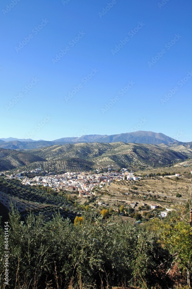 View of whitewashed village (pueblo blanco) and surrounding countryside, Algarinejo, Andalusia, Spain.