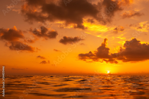 Colorful sunset over ocean surface.