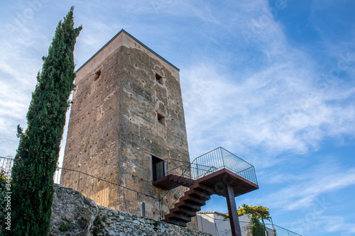 Medieval tower in the town of Almudaina in Alicante mountains. photo