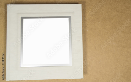 Photo album over wooden background. Close-up album