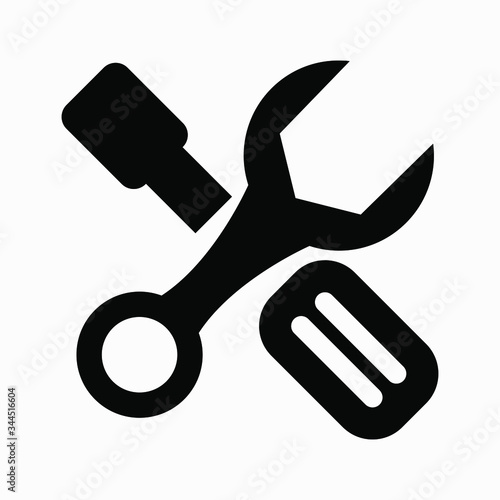 New crossed black and white wrench and screwdriver logo design elements.