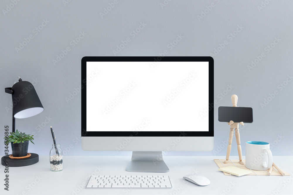 Computer with blank white copy space for text, Mockup design desktop computer in office on white table with keyboard and Coffee cub, Work place concept. Computer with blank white copy space for text, Mockup design desktop computer in office on white table with keyboard and Coffee cub, Work place concept.