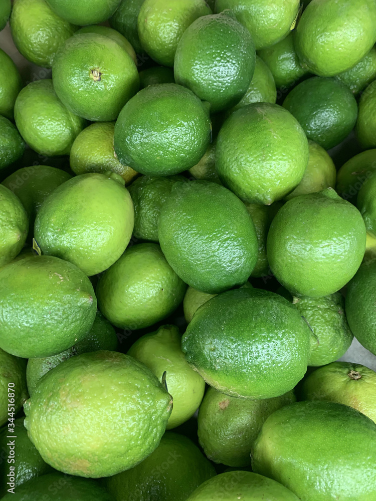 lots of ripe green limes for cooking a background lots of ripe green limes for cooking a background