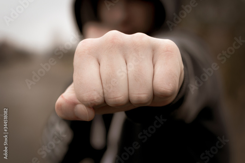 Φωτογραφία Hand clenched a fist. male punch close up