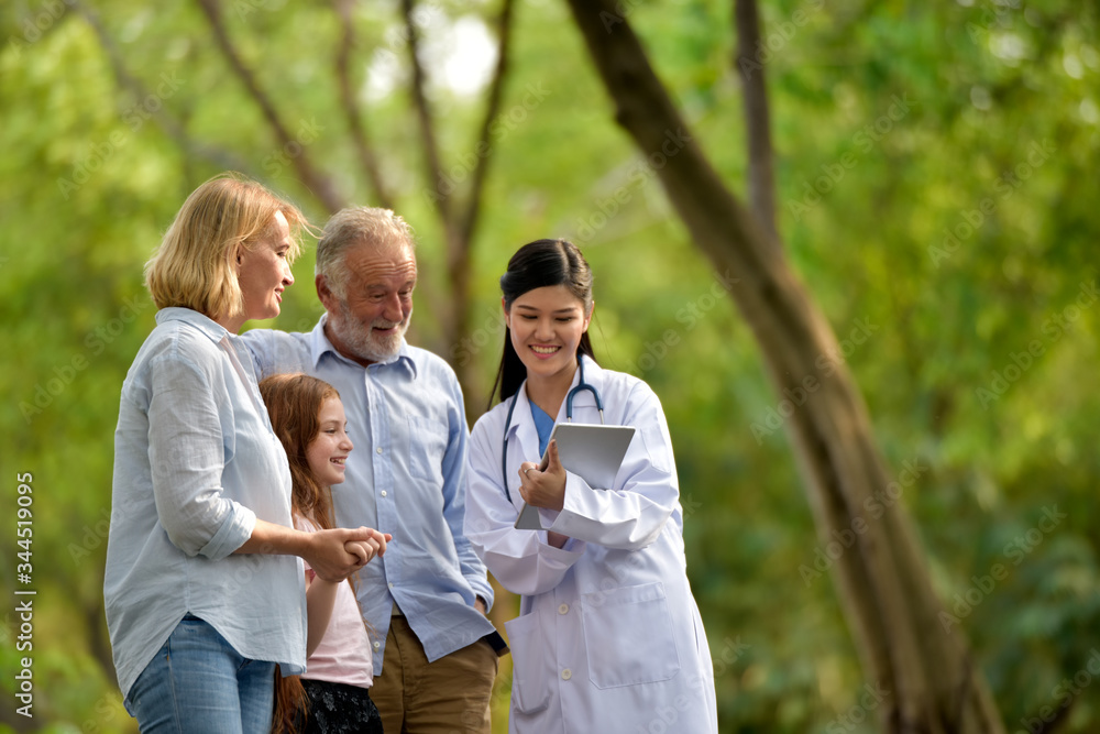 Female doctor and her elderly patient outdoor. Female doctor and her elderly patient outdoor.