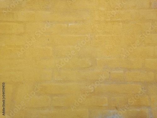 yellow brick wall surface