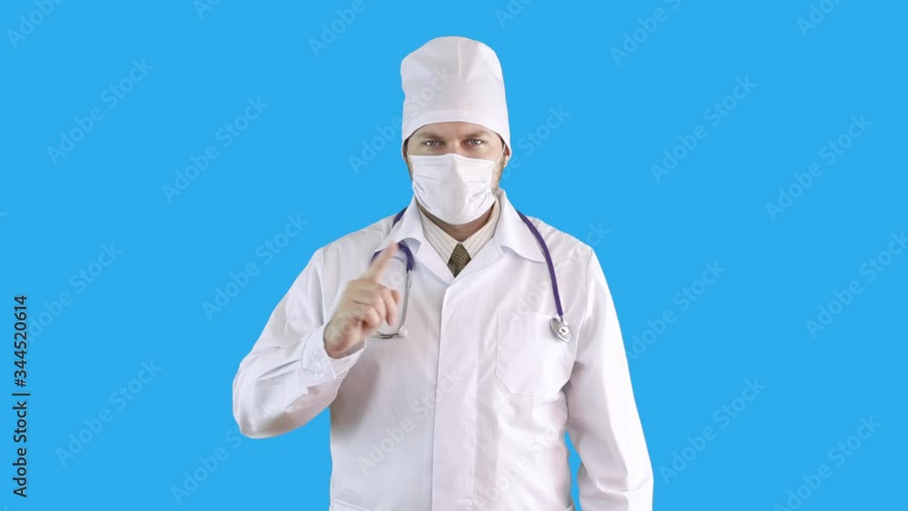 Masked medical worker shows with his hand that this cannot be done. Masked medical worker shows with his hand that this cannot be done.