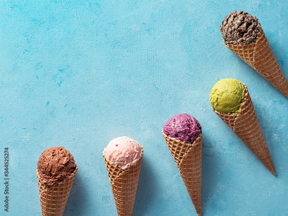 Fotografie Various ice cream scoops in cones with copy space