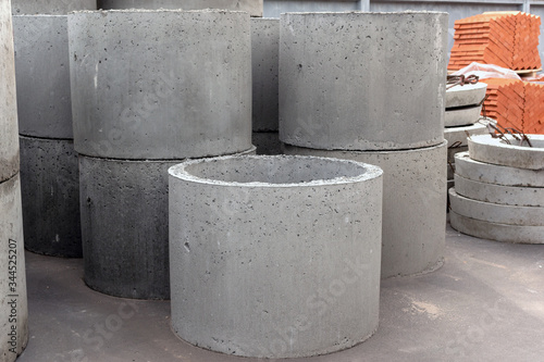 new round sewer concrete rings for sewage. sale of building materials in the open air