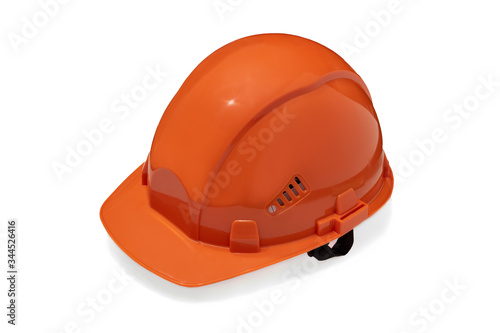isolated orange construction helmet on a white background. Specialized clothes. Personal protective equipment. construction. isolate