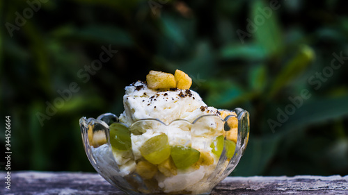 Indian Dried fruit Shrikhand. Shrikhand is an Indian sweet dish made of strained dahi. photo