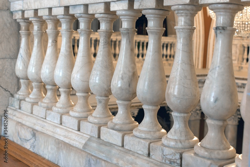 Balusters made of white marble. fragment of the interior of classical architecture close-up.