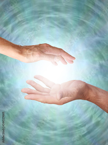 Canvas-taulu Male and Female sensing energy field  - male hand opposite female hand with a wh