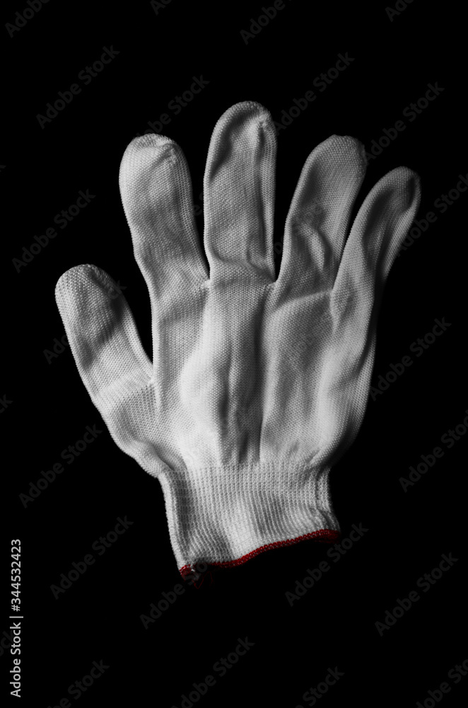 Glove made of white fabric on a black background. International signs and symbols. Youth symbols. Common gestures. Gestures with his fingers. International gestures. Sign language. The youth gestures. Glove made of white fabric on a black background. International signs and symbols. Youth symbols. Common gestures. Gestures with his fingers. International gestures. Sign language. The youth gestures.