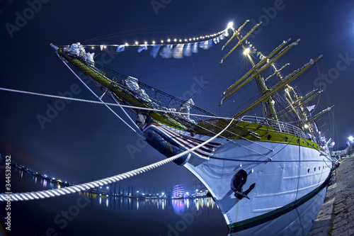 Photos Sailing ship tied to a pier, shot with a fish eye lens.