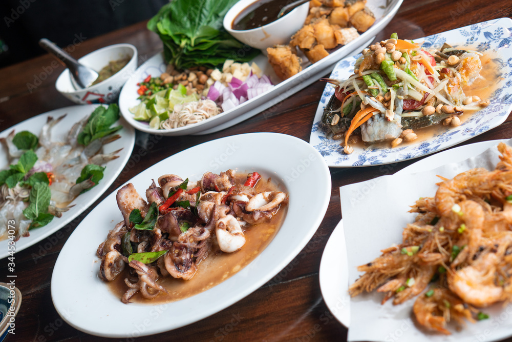Background delicious tasty authentic real exotic Thai seafood meal set for lunch and dinner food. Healthy organic homemade fresh seafood true local menu natural ingredient from local fisherman market Background delicious tasty authentic real exotic Thai seafood meal set for lunch and dinner food. Healthy organic homemade fresh seafood true local menu natural ingredient from local fisherman market