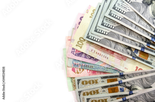 Different hryvnia dollars isolated on a white background. Copy space. Place for text.