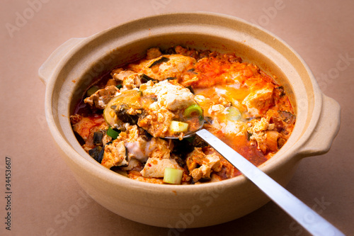 Korean spicy silken tofu stew which is called Sundubu Jjigae