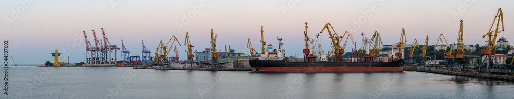 Freight international sea port with cargo ship, cranes and containers or boxes with goods. Global shipping, delivery and.