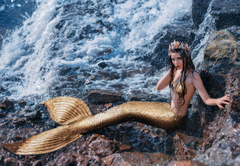 Fantasy woman real mermaid myth goddess of sea. Art goldfish creative costume ocean siren sexy body spa relaxation. mystic spirit of lake river floats swimming in water. sunset nature Magic sun light 