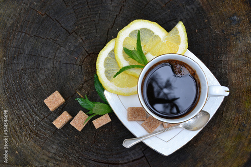 White cup of coffee with lemom and sugar  photo