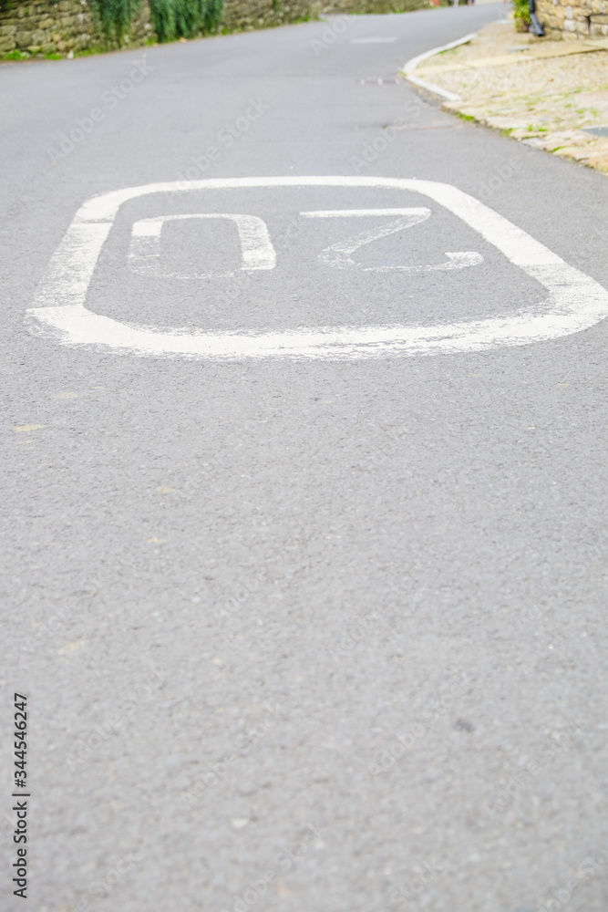 a speed limit sign painted on the road a speed limit sign painted on the road