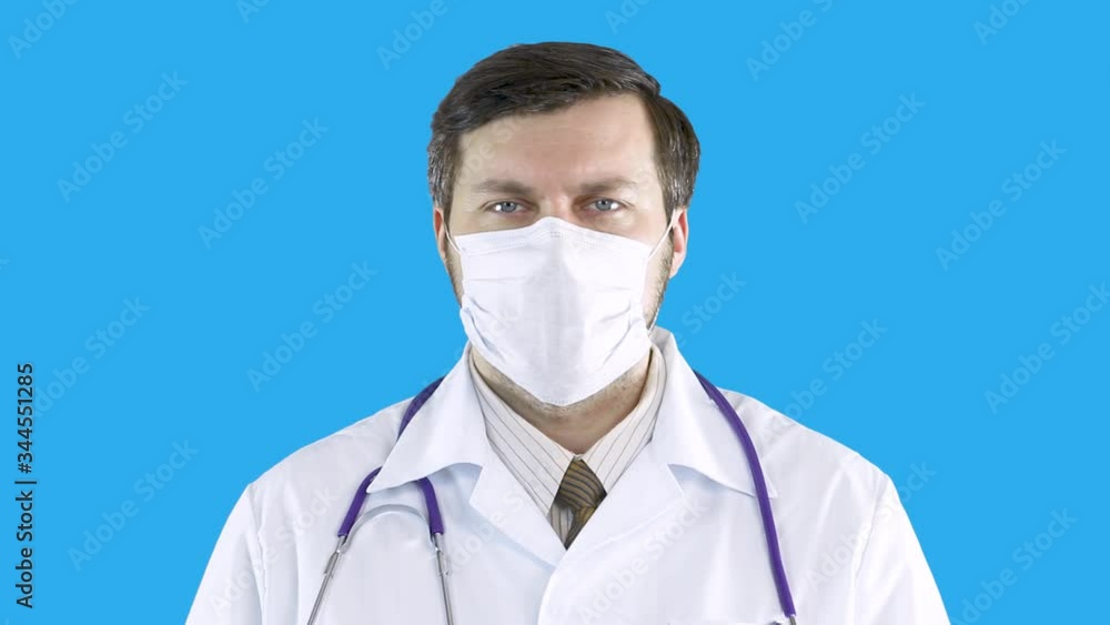 Portrait of a man in a medical coat and mask. Portrait of a man in a medical coat and mask.
