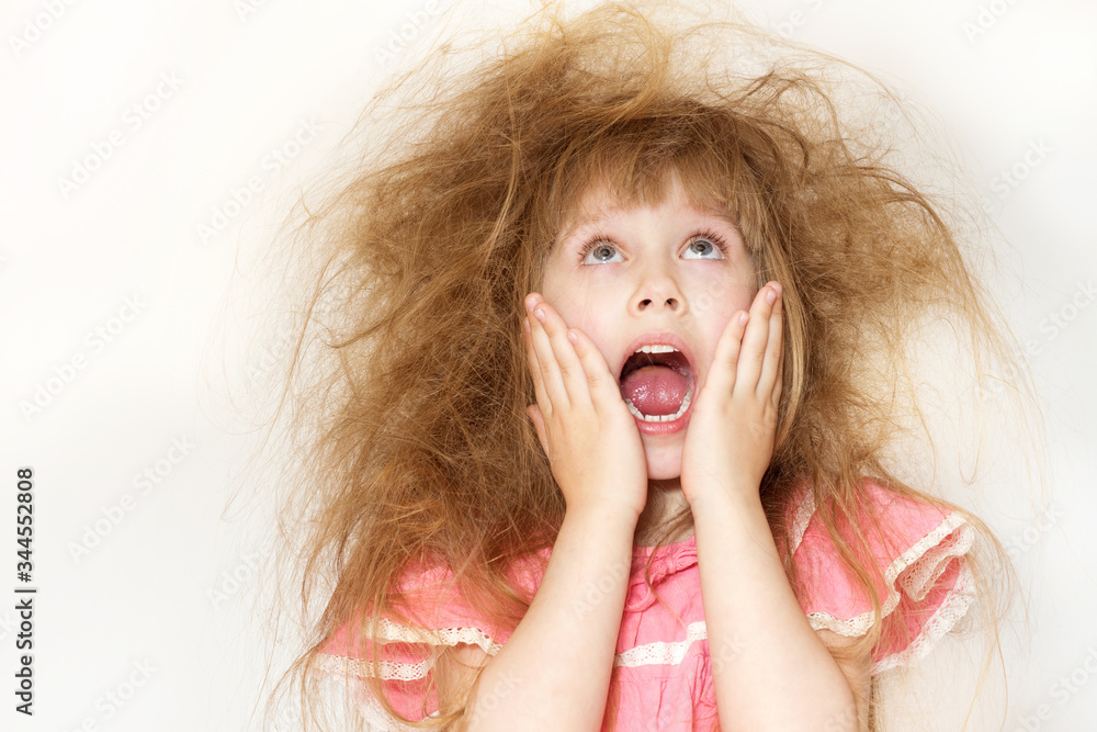a little girl with tangled long hair screams not knowing what to do with it a little girl with tangled long hair screams not knowing what to do with it