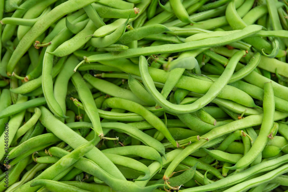 Pile of green beans, Haricots Verts at local producers street fruit and vegetables market, organic ecological food Pile of green beans, Haricots Verts at local producers street fruit and vegetables market, organic ecological food